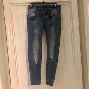 Distressed denim jeans